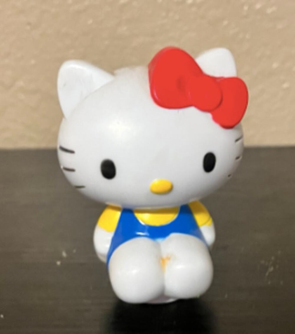 Sanrio Hello Kitty Sitting Figure Blue Overalls Yellow Shirt Red Bow